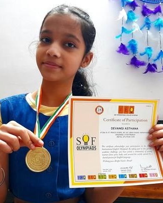 Devangi with her English Olympiad gold medal