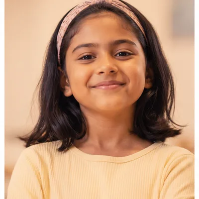 Confident child smiling at HOSS